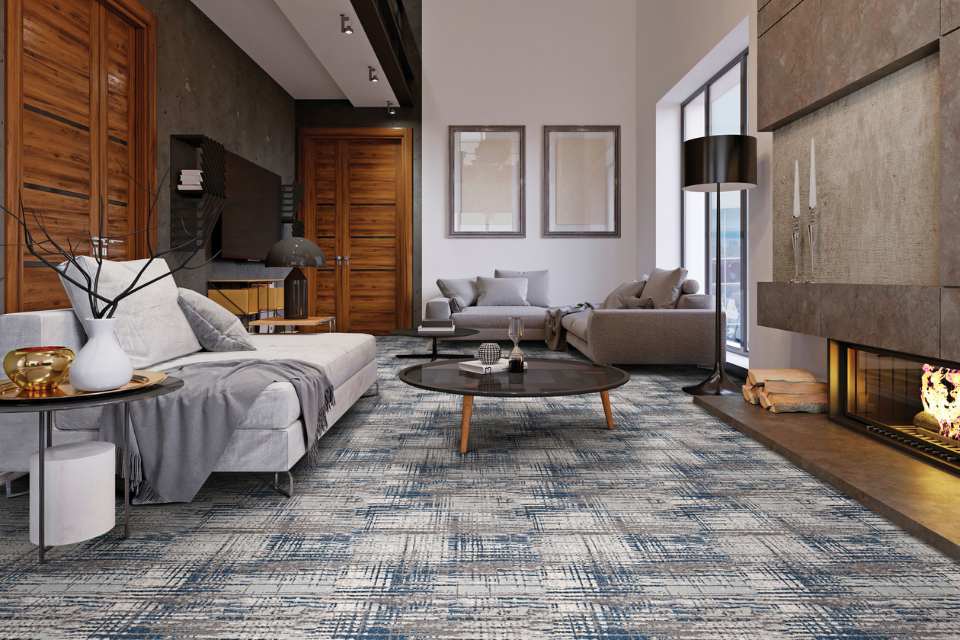 patterned carpet in retro living room with gray tones and wood accent paneling